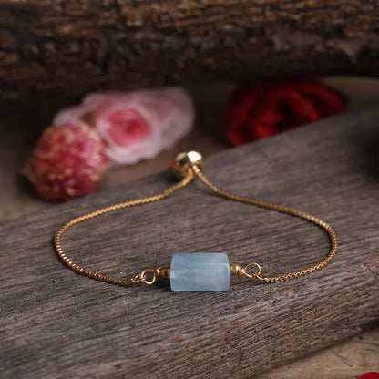 Bracelet ajustable en chaîne dorée avec pierres prismatiques