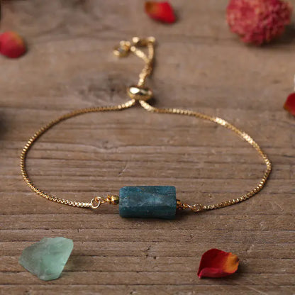 Bracelet ajustable en chaîne dorée avec pierres prismatiques